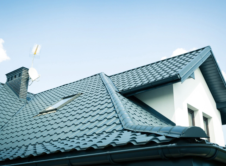 green metal roof tiles of residential house